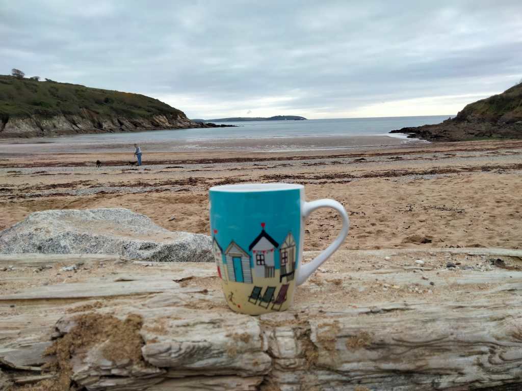 picture of cup of tea at the beach